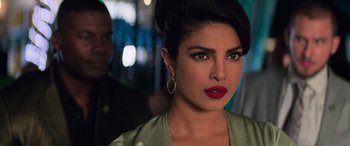Movie still from “Baywatch” (2017), directed by Seth Gordon – A person wearing a green jacket; Close Up shot, Over the shoulder angle