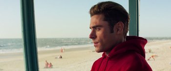 Movie still from “Baywatch” (2017), directed by Seth Gordon – A person on a beach near the ocean; Close Up shot, Over the shoulder angle