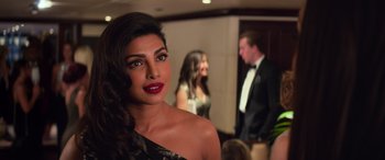 Movie still from “Baywatch” (2017), directed by Seth Gordon – A person wearing a dress; Close Up shot, Over the shoulder angle