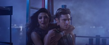 Movie still from “Baywatch” (2017), directed by Seth Gordon – A man and a woman are posing for a picture; Close Up shot, Low angle