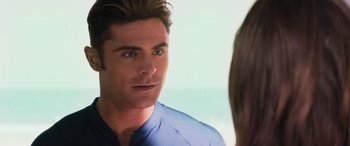 Movie still from “Baywatch” (2017), directed by Seth Gordon – A person looking into a mirror; Close Up shot, Over the shoulder angle