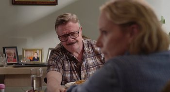 Movie still from “Beau Is Afraid” (2023), directed by Ari Aster – A man and a woman sitting at a dinner table; Close Up shot, Over the shoulder angle