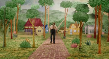 Movie still from “Beau Is Afraid” (2023), directed by Ari Aster – A man walking down a brick path in a village; Extreme Wide shot, High angle