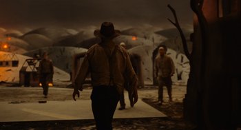 Movie still from “Beau Is Afraid” (2023), directed by Ari Aster – A man wearing a cowboy hat walking in the dark; Wide shot, Over the shoulder angle