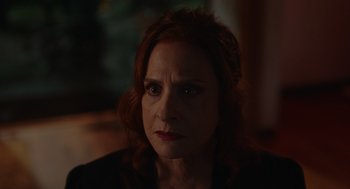 Movie still from “Beau Is Afraid” (2023), directed by Ari Aster – A person with red curly hair; Close Up shot, Over the shoulder angle