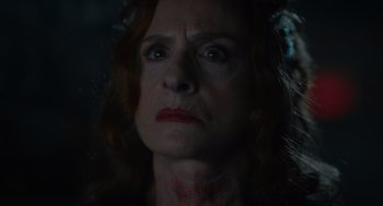 Movie still from “Beau Is Afraid” (2023), directed by Ari Aster – A person with red curly hair; Close Up shot, Low angle