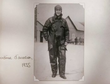 Movie still from “Becoming Cousteau” (2021), directed by Liz Garbus – An old photo of a man in a winter outfit; Medium shot, High angle