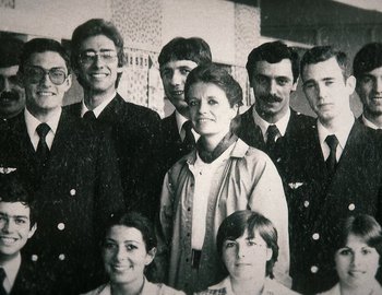 Movie still from “Becoming Cousteau” (2021), directed by Liz Garbus – A group of people standing next to each other in a room; Extreme Close Up shot, Low angle