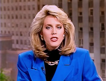 Movie still from “Becoming Cousteau” (2021), directed by Liz Garbus – A woman in a blue jacket and black shirt; Close Up shot, Low angle