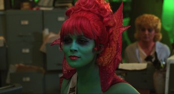 Movie still from “Beetlejuice” (1988), directed by Tim Burton – A woman with red hair and a green face; Close Up shot, Over the shoulder angle