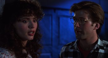 Movie still from “Beetlejuice” (1988), directed by Tim Burton – A man and a woman are talking to each other; Close Up shot, Over the shoulder angle