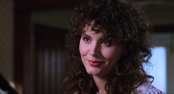 Movie still from “Beetlejuice” (1988), directed by Tim Burton – A person with curly brown hair; Close Up shot, Low angle