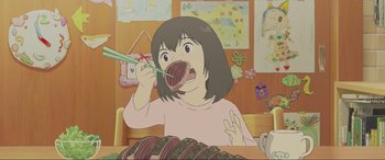 Movie still from “Belle” (2021), directed by Mamoru Hosoda – A girl is holding a fork in her mouth while sitting in front of a table; Medium shot, High angle