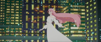 Movie still from “Belle” (2021), directed by Mamoru Hosoda – A woman with long pink hair is standing in front of a city skyline; Wide shot, Low angle
