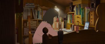 Movie still from “Belle” (2021), directed by Mamoru Hosoda – A woman sitting at a desk writing on a book; Medium shot, High angle