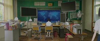 Movie still from “Belle” (2021), directed by Mamoru Hosoda – A computer room with a map of the world on the wall; Extreme Wide shot, High angle