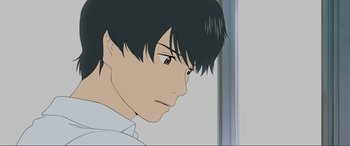 Movie still from “Belle” (2021), directed by Mamoru Hosoda – A man with black hair is looking at the camera; Close Up shot, Over the shoulder angle