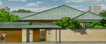 Movie still from “Belle” (2021), directed by Mamoru Hosoda – An illustration of a building with a green tile roof; Extreme Wide shot, Low angle