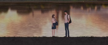 Movie still from “Belle” (2021), directed by Mamoru Hosoda – A man and a woman standing next to a body of water; Extreme Wide shot, Low angle
