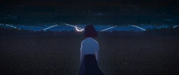 Movie still from “Belle” (2021), directed by Mamoru Hosoda – A woman standing in front of an open field at night; Extreme Wide shot, High angle