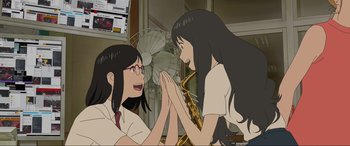 Movie still from “Belle” (2021), directed by Mamoru Hosoda – Two women are playing a musical instrument together; Close Up shot, Over the shoulder angle