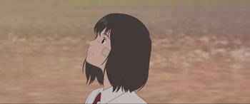 Movie still from “Belle” (2021), directed by Mamoru Hosoda – An animated picture of a woman looking up at the sky; Close Up shot, Low angle