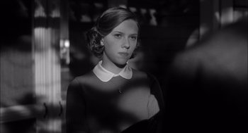 Movie still from “The Man Who Wasn't There” (2001), directed by Joel Coen – A young woman in a black and white photo; Close Up shot, Low angle