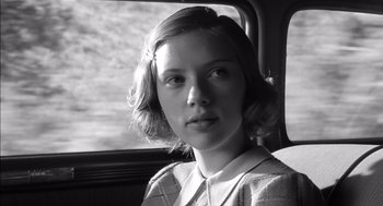 Movie still from “The Man Who Wasn't There” (2001), directed by Joel Coen – A woman sitting in a car looking out the window; Close Up shot, Low angle