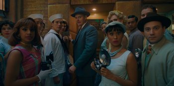Movie still from “Better Nate Than Ever” (2022), directed by Tim Federle – A group of men and women standing next to each other; Medium shot, Low angle
