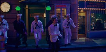Movie still from “Better Nate Than Ever” (2022), directed by Tim Federle – A group of men dressed in sailor's outfits; Wide shot, High angle