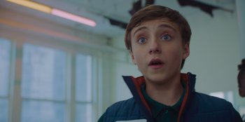 Movie still from “Better Nate Than Ever” (2022), directed by Tim Federle – A young boy looking surprised at the camera; Close Up shot, Low angle
