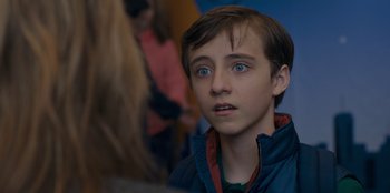 Movie still from “Better Nate Than Ever” (2022), directed by Tim Federle – A young boy with blue eyes stares into the distance; Close Up shot, Over the shoulder angle