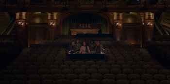 Movie still from “Better Nate Than Ever” (2022), directed by Tim Federle – A group of people sitting in the middle of an auditorium; Extreme Wide shot, High angle