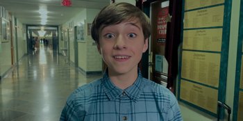 Movie still from “Better Nate Than Ever” (2022), directed by Tim Federle – A young man with a surprised look on his face; Close Up shot, Low angle