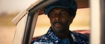 Movie still from “Big George Foreman” (2023), directed by George Tillman Jr. – A person wearing a hat; Close Up shot, Low angle