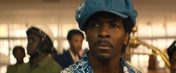 Movie still from “Big George Foreman” (2023), directed by George Tillman Jr. – A person wearing a hat; Close Up shot, Low angle