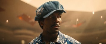 Movie still from “Big George Foreman” (2023), directed by George Tillman Jr. – A person wearing a hat; Close Up shot, Low angle