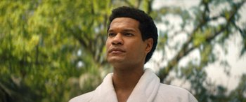 Movie still from “Big George Foreman” (2023), directed by George Tillman Jr. – A person wearing a bathrobe; Close Up shot, Low angle