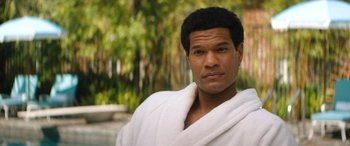 Movie still from “Big George Foreman” (2023), directed by George Tillman Jr. – A person wearing a robe; Close Up shot, Over the shoulder angle