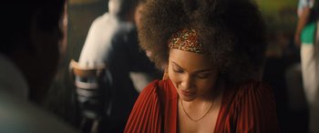 Movie still from “Big George Foreman” (2023), directed by George Tillman Jr. – A person wearing a red shirt; Close Up shot, Over the shoulder angle