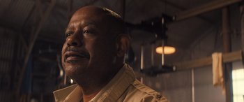 Movie still from “Big George Foreman” (2023), directed by George Tillman Jr. – A person with a mustache; Close Up shot, Low angle
