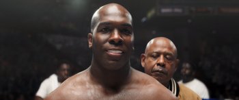 Movie still from “Big George Foreman” (2023), directed by George Tillman Jr. – A man's face in a boxing ring; Close Up shot, Low angle