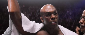 Movie still from “Big George Foreman” (2023), directed by George Tillman Jr. – A person with a towel on his head; Close Up shot, Low angle