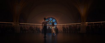 A couple of people that are standing in a room