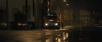 Movie still from “Birds of Prey” (2020), directed by Cathy Yan – A semi truck parked on the side of the street; Extreme Wide shot, Low angle