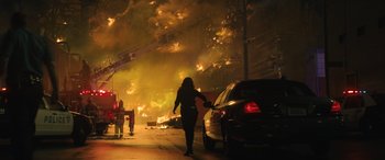 Movie still from “Birds of Prey” (2020), directed by Cathy Yan – A person walking on a street near a car; Extreme Wide shot, Low angle