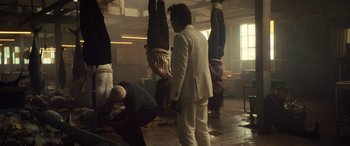 Movie still from “Birds of Prey” (2020), directed by Cathy Yan – A group of people hanging upside down in a room; Wide shot, Low angle