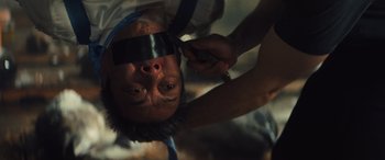 Movie still from “Birds of Prey” (2020), directed by Cathy Yan – A man with a blindfold on his head; Close Up shot, Low angle