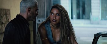 Movie still from “Birds of Prey” (2020), directed by Cathy Yan – A man and a woman with dreadlocks talking to each other; Close Up shot, Over the shoulder angle