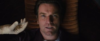 Movie still from “Birds of Prey” (2020), directed by Cathy Yan – A man's face in the dark; Close Up shot, Overhead angle